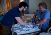 Daddy getting lessons on how to bathe